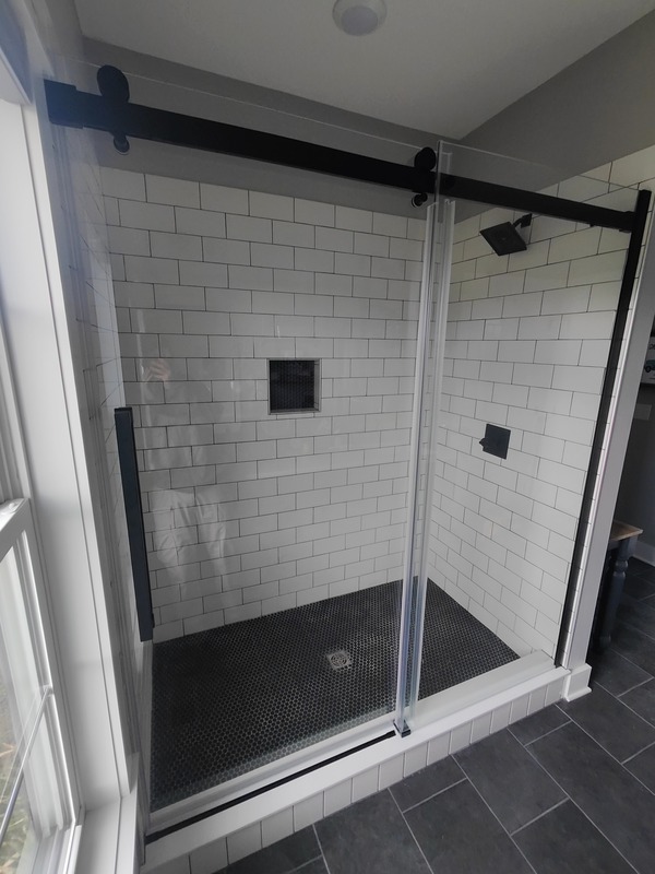 Sliding glass shower door installation completed by HandySmart in Mooresville, Indiana.